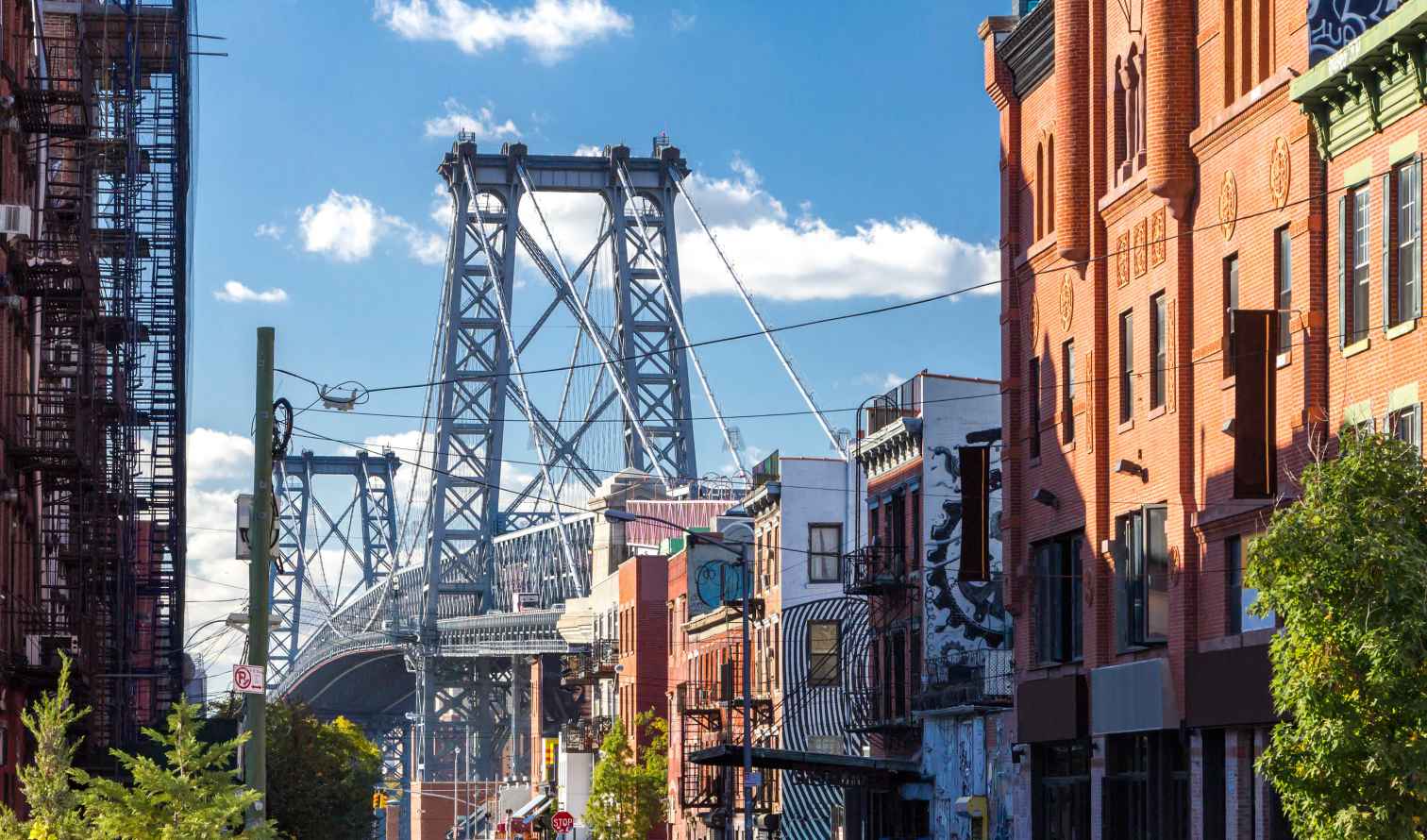 Williamsburg Bridge seen through a street in Brooklyn, New York.