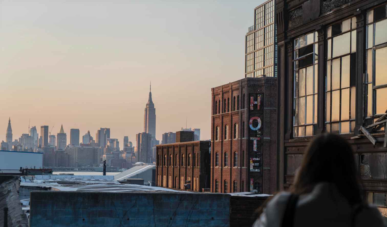 Empire State Building and New York City skyline at sunset.