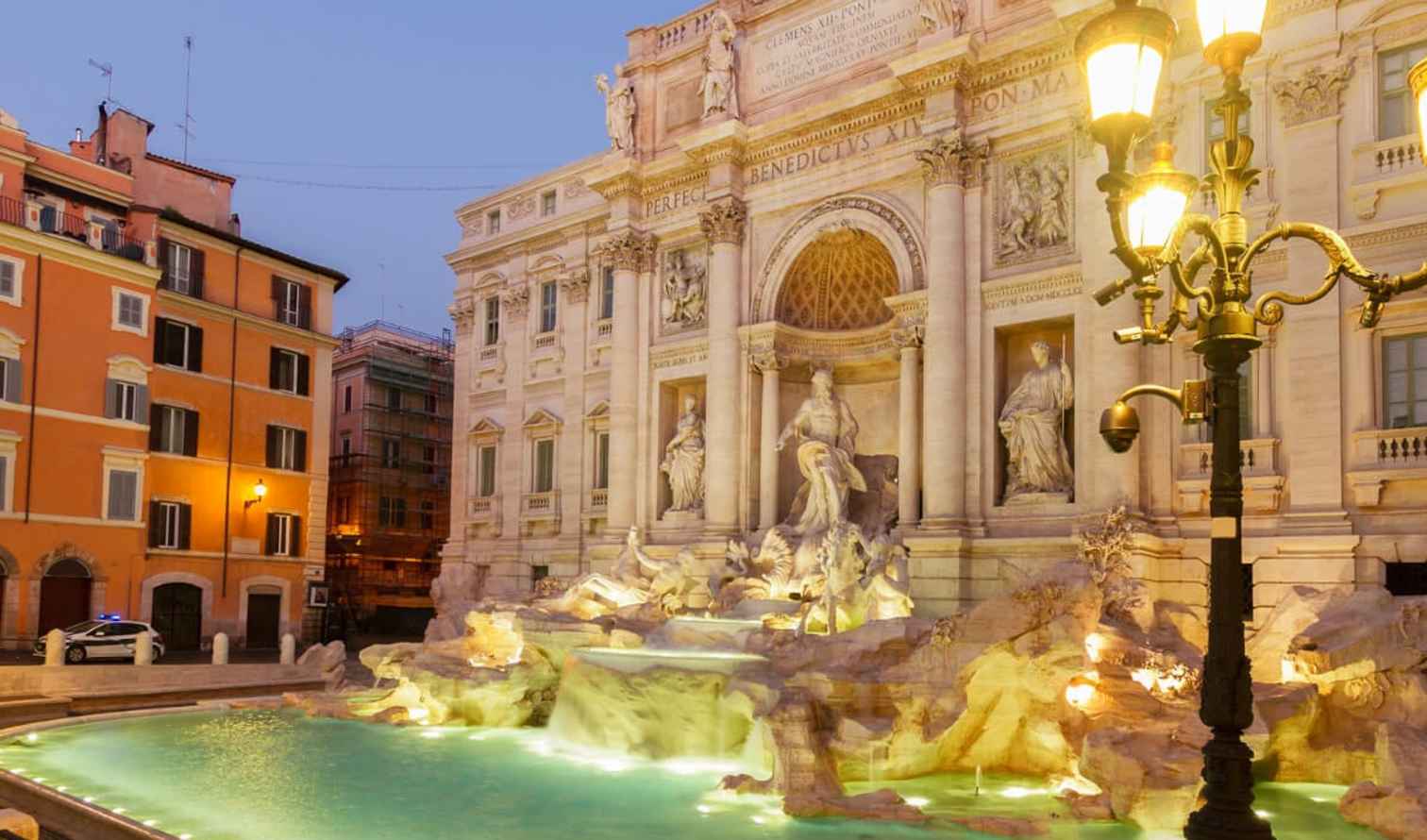 Trevi Fountain illuminated at night in Rome, Italy.