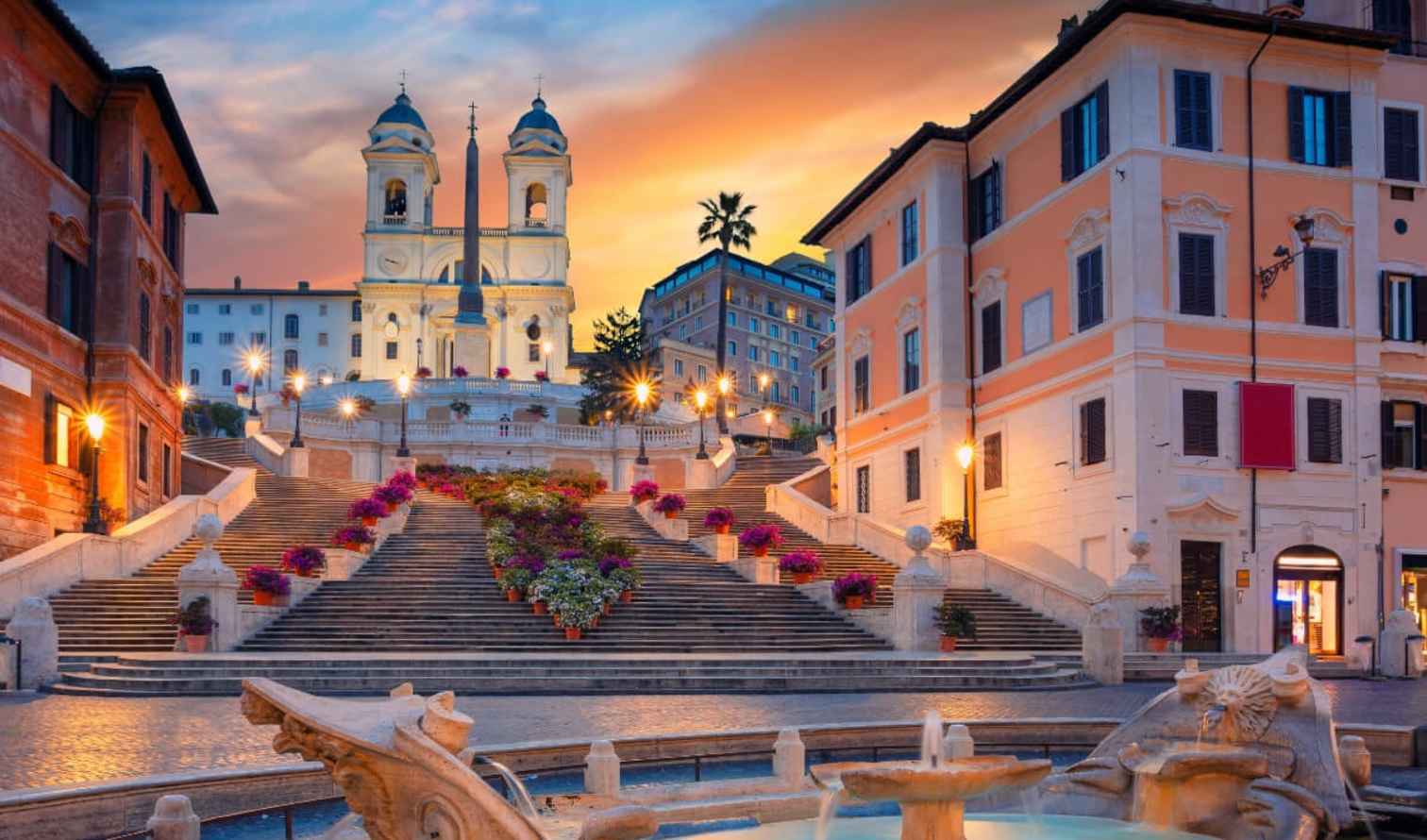 The Spanish Steps with Trinità dei Monti church in Rome at sunset.