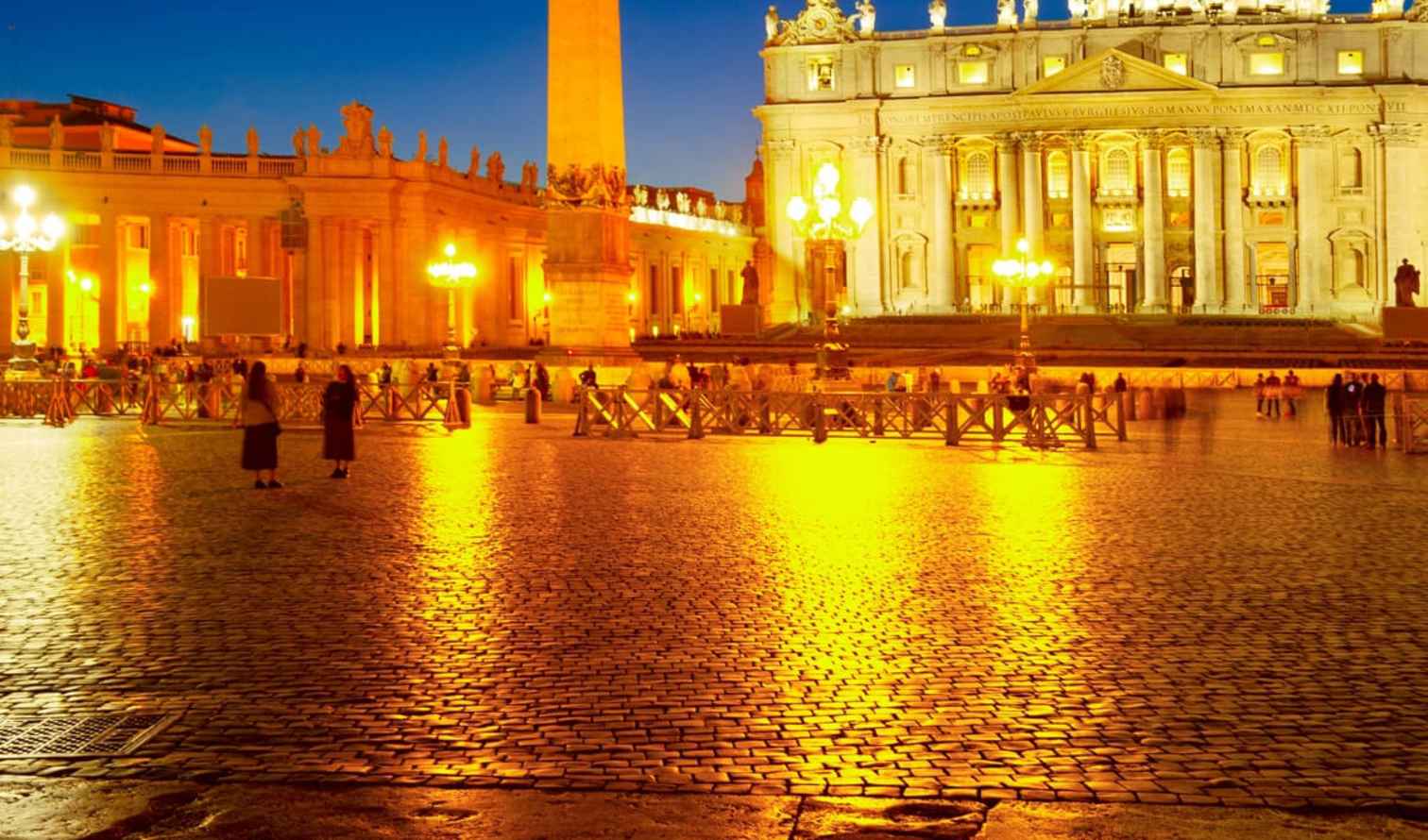 People walking near St. Peter's Basilica in Vatican City.