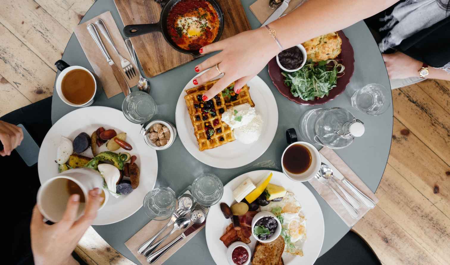 Overhead view of a table with various brunch dishes and drinks in San Francisco