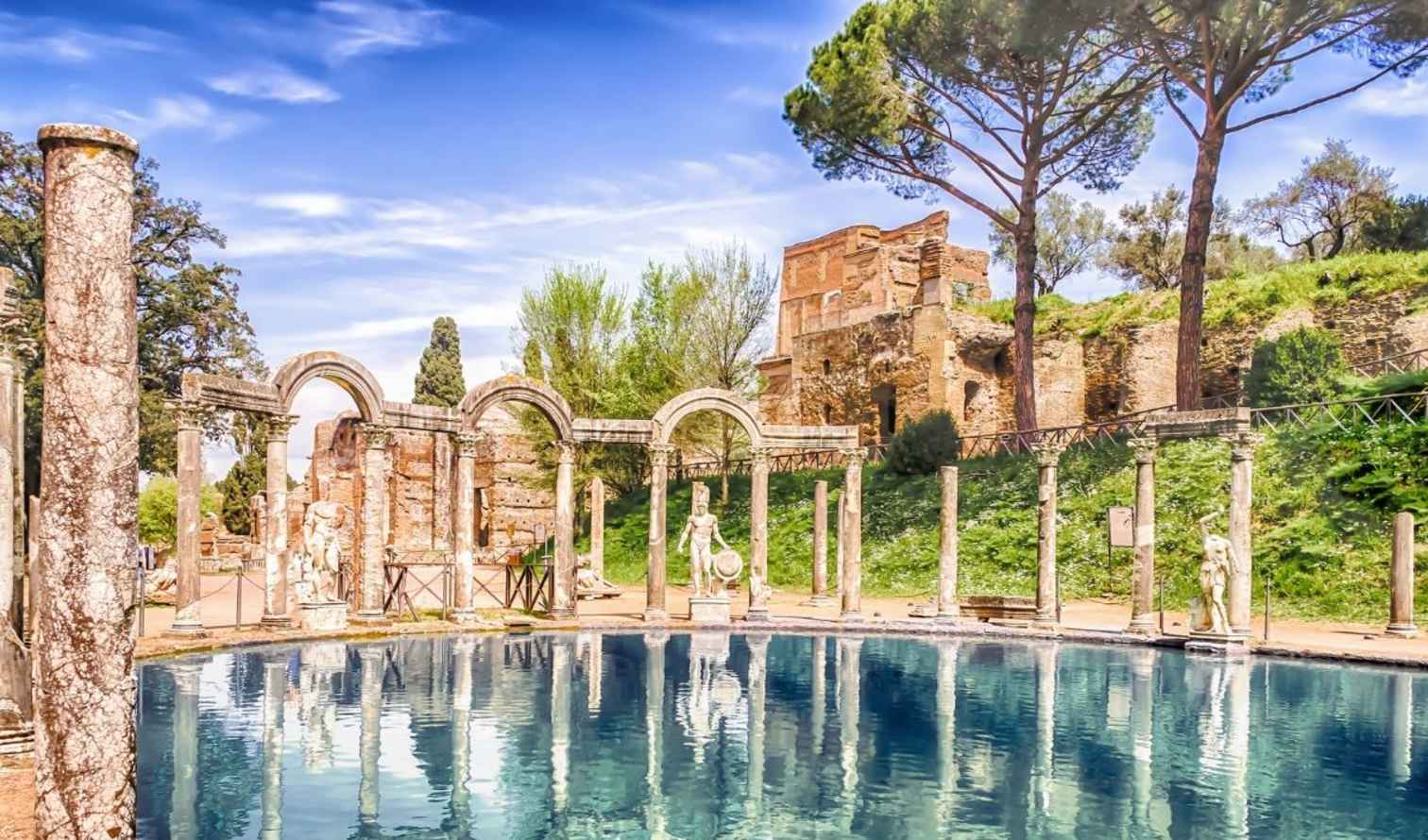 View of Hadrian's Villa with trees and Roman architecture.