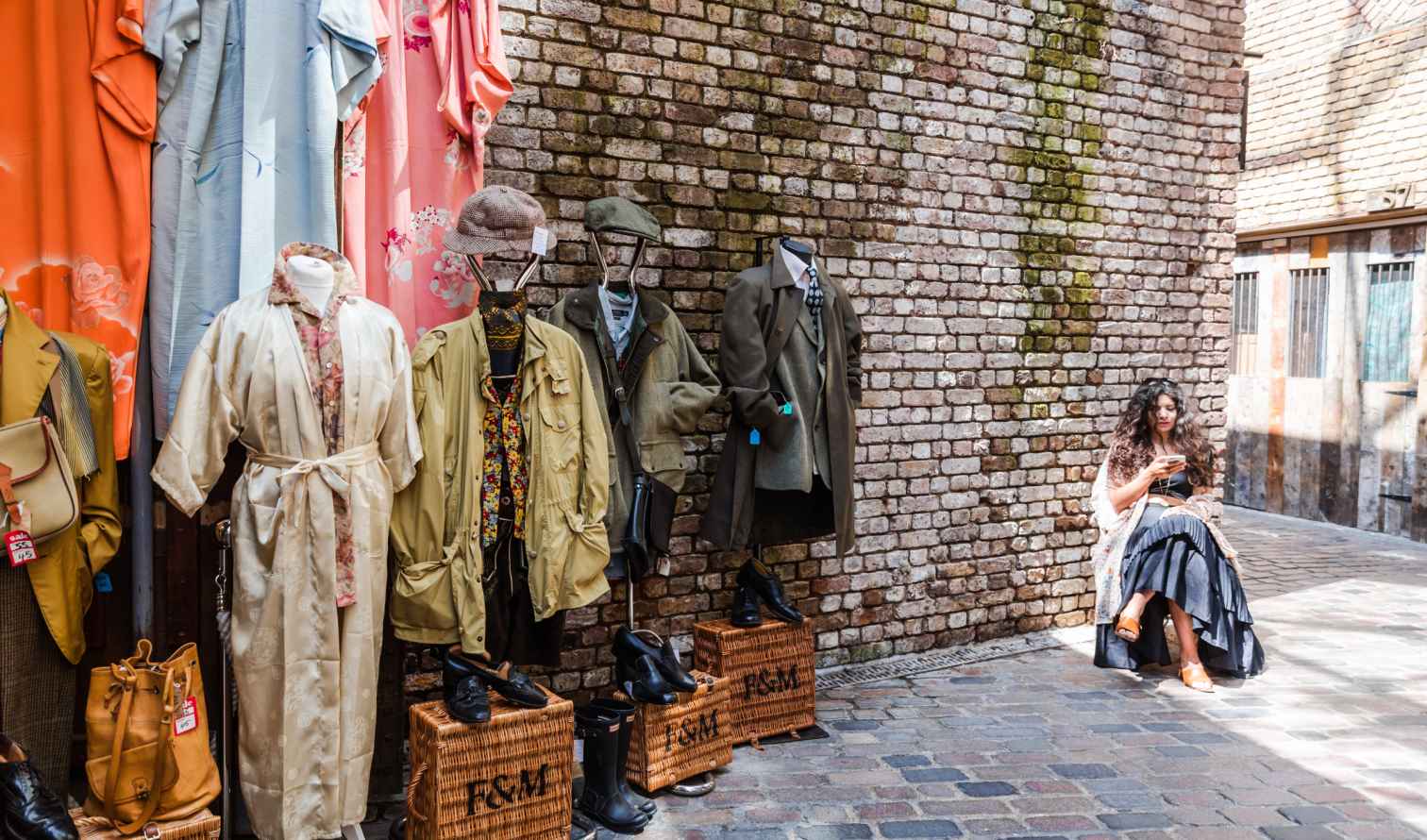 Vintage clothing displayed on mannequins in Le Marais, Paris.