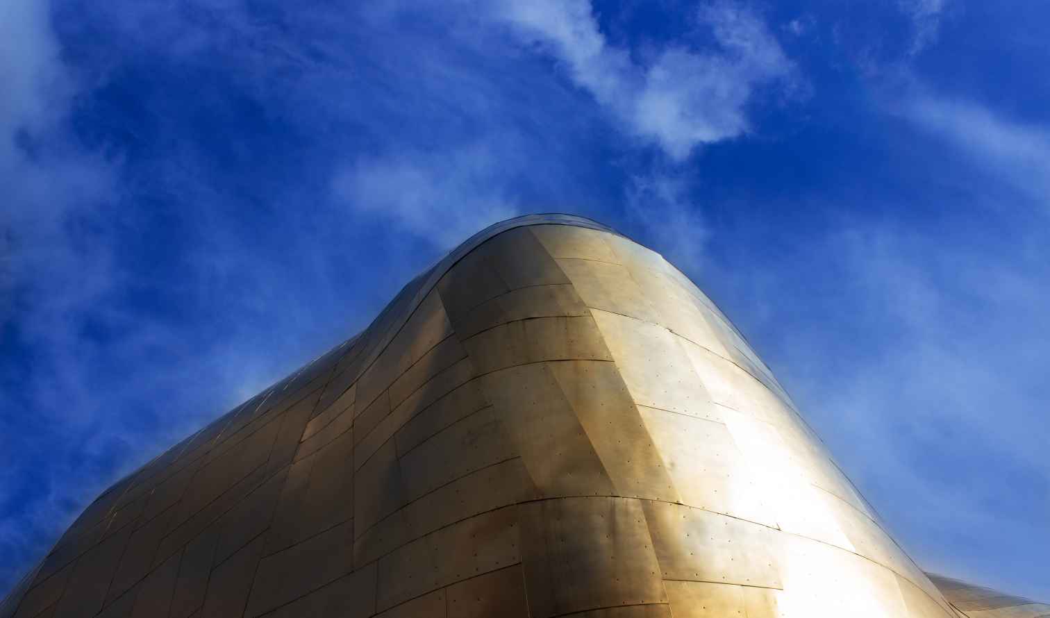 Close-up of the Museum of Pop Culture's gold metallic exterior in Seattle.