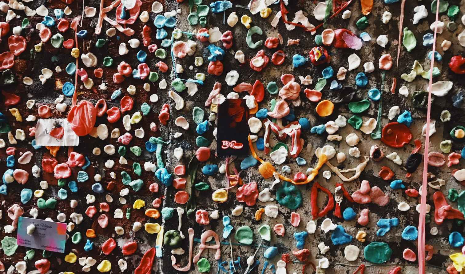 Close-up of Seattle's Gum Wall covered in colorful chewing gum.