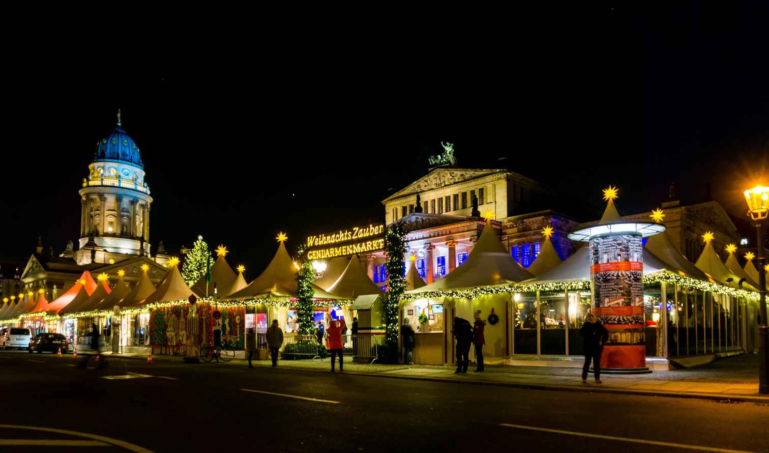 Christmas market at Gendarmenmarkt, Berlin with the French Cathedral in the background.