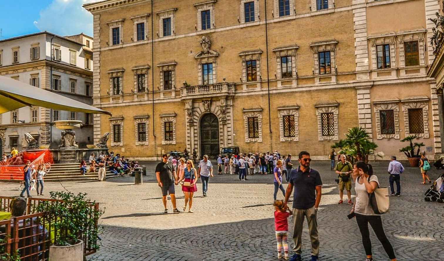 People gather at Piazza Santa Maria in Trastevere, Rome.