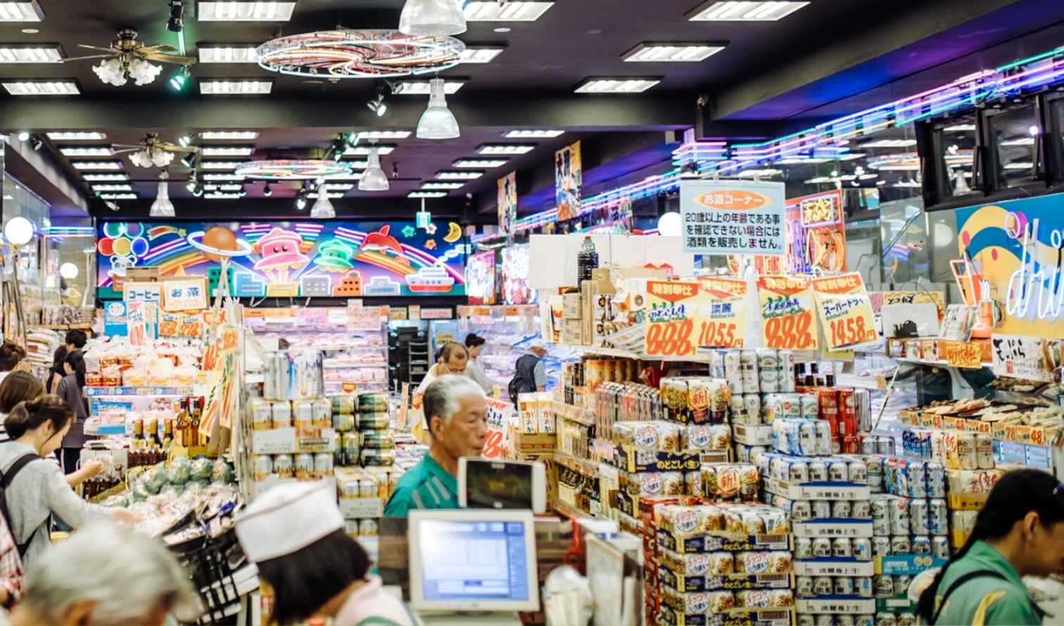 Interior of a Japanese supermarket with neon signs and colorful displays Osaka