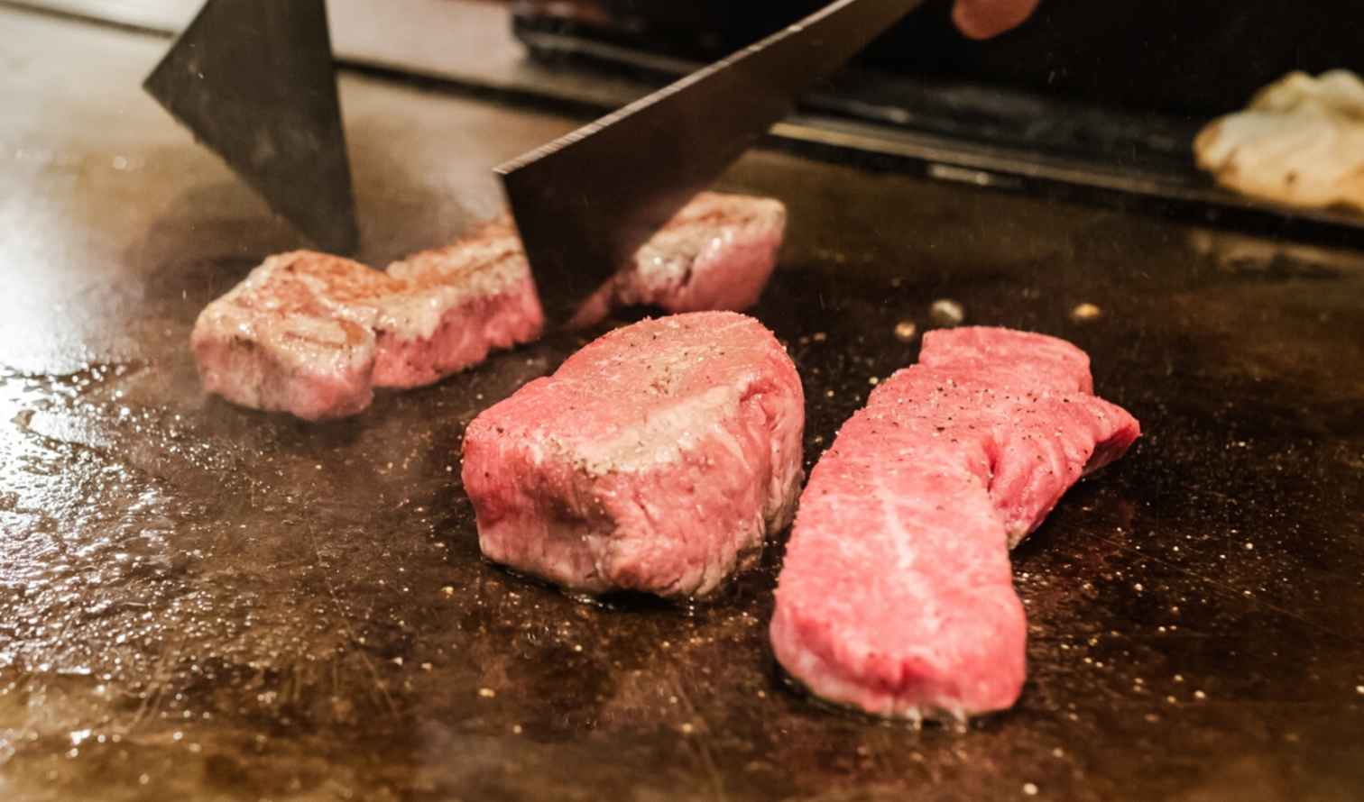 Close-up of beef cooking on a teppanyaki grill Osaka