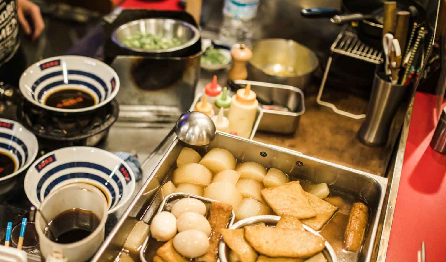 Ramen bowls and oden ingredients on a Japanese restaurant counter Fukuoka