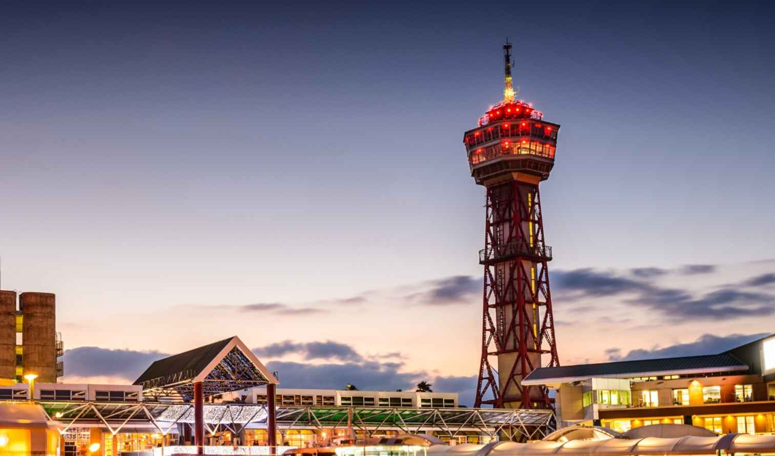 Port Vell area in Barcelona with a lit observation tower at dusk Fukuoka