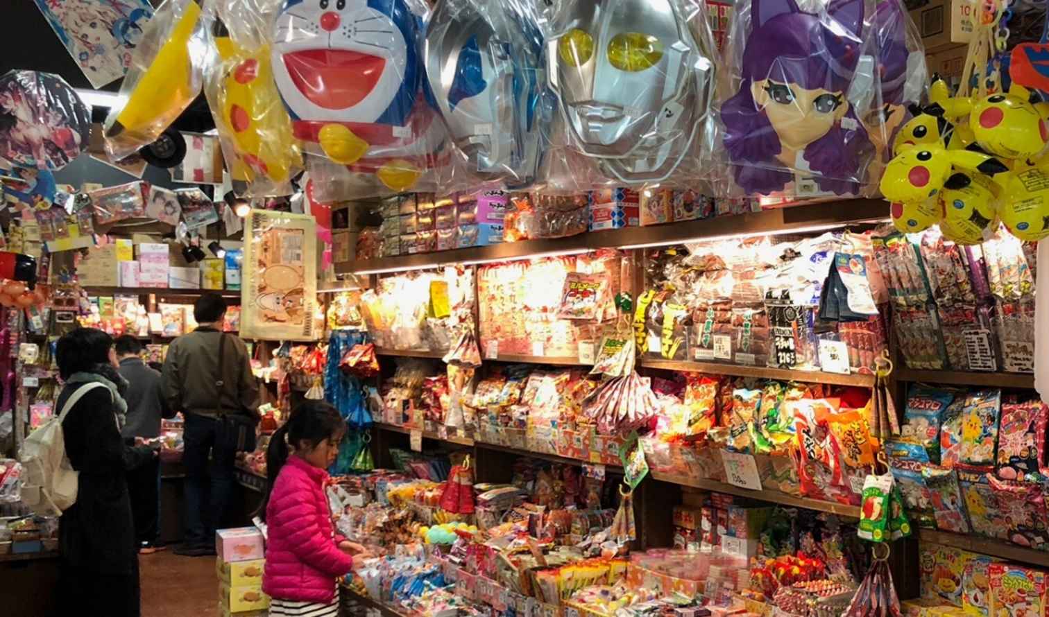 Interior of a Japanese candy store with shelves of snacks and toys in Tokyo