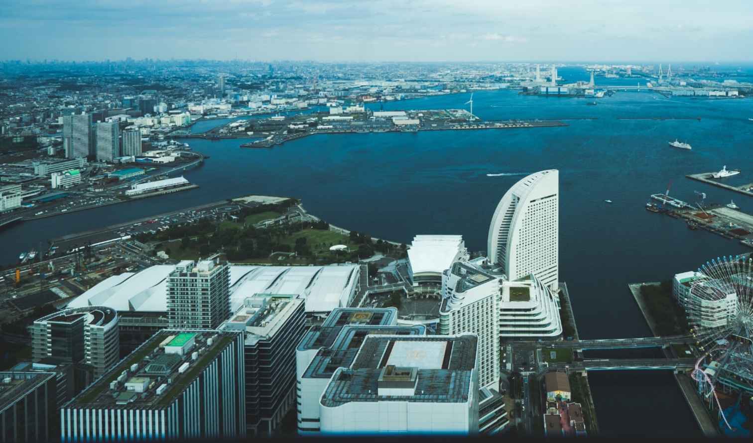 Aerial view of Yokohama, Japan with sea and urban landscape.