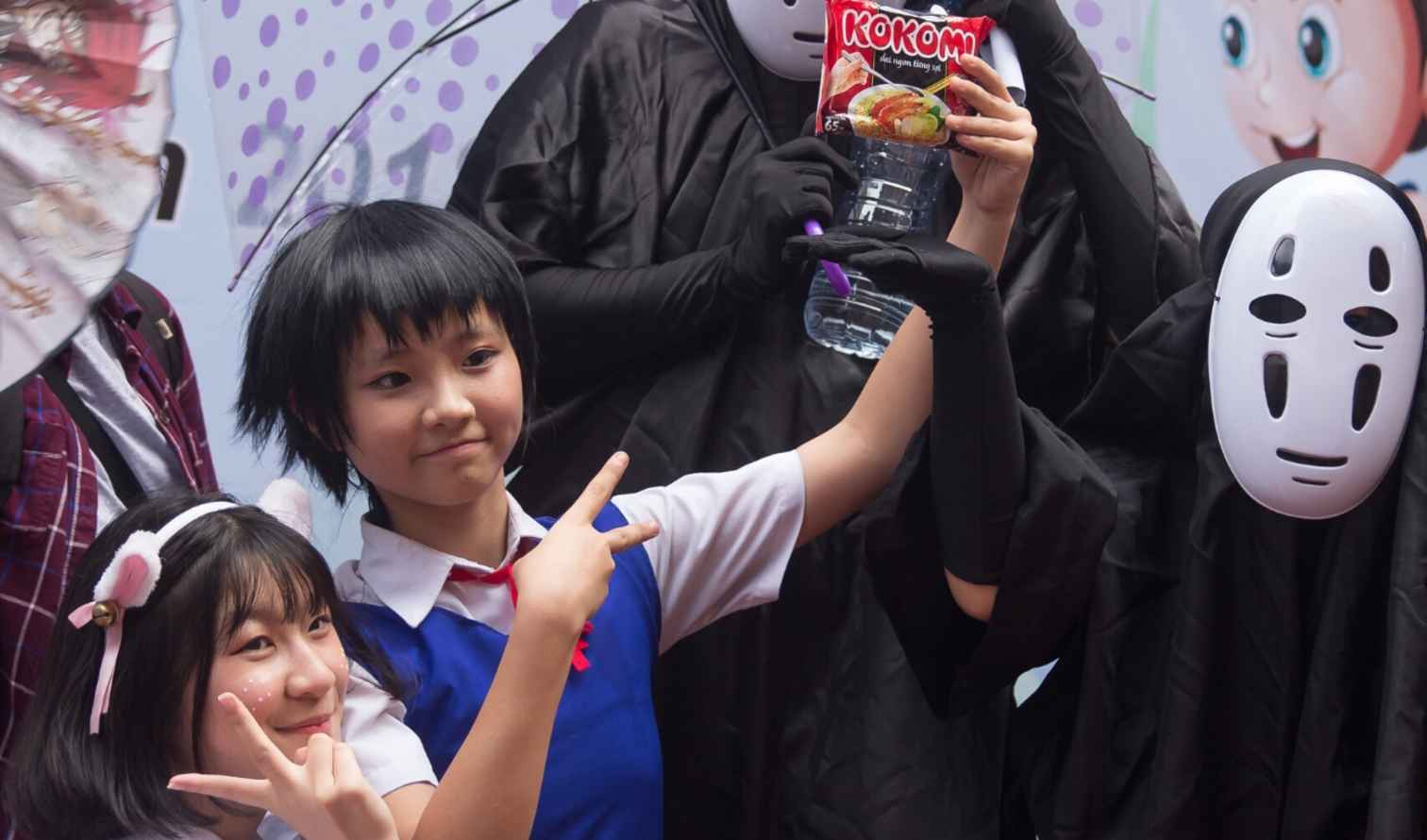Group dressed in anime character costumes at a public event in Nagoya