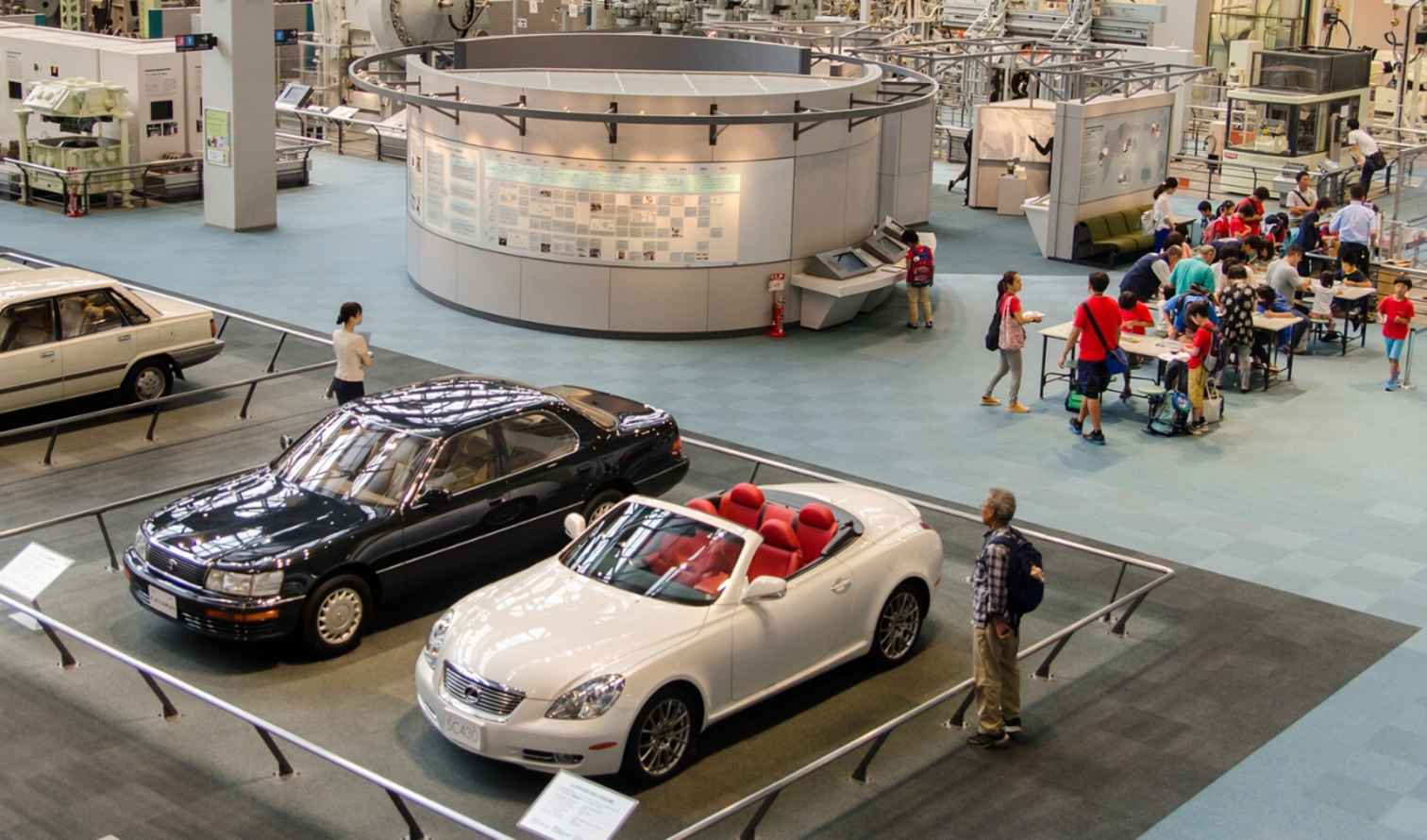 Visitors observe a car exhibit at Toyota Automobile Museum in Nagoya, Japan.