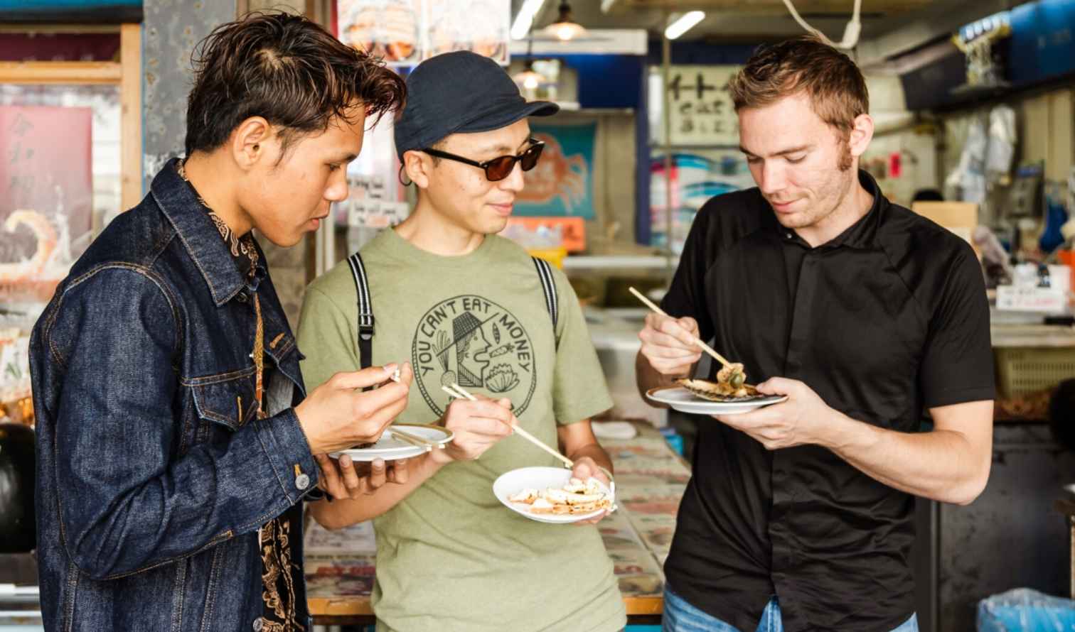 People tasting food at Tsukiji Outer Market, Sapporo.