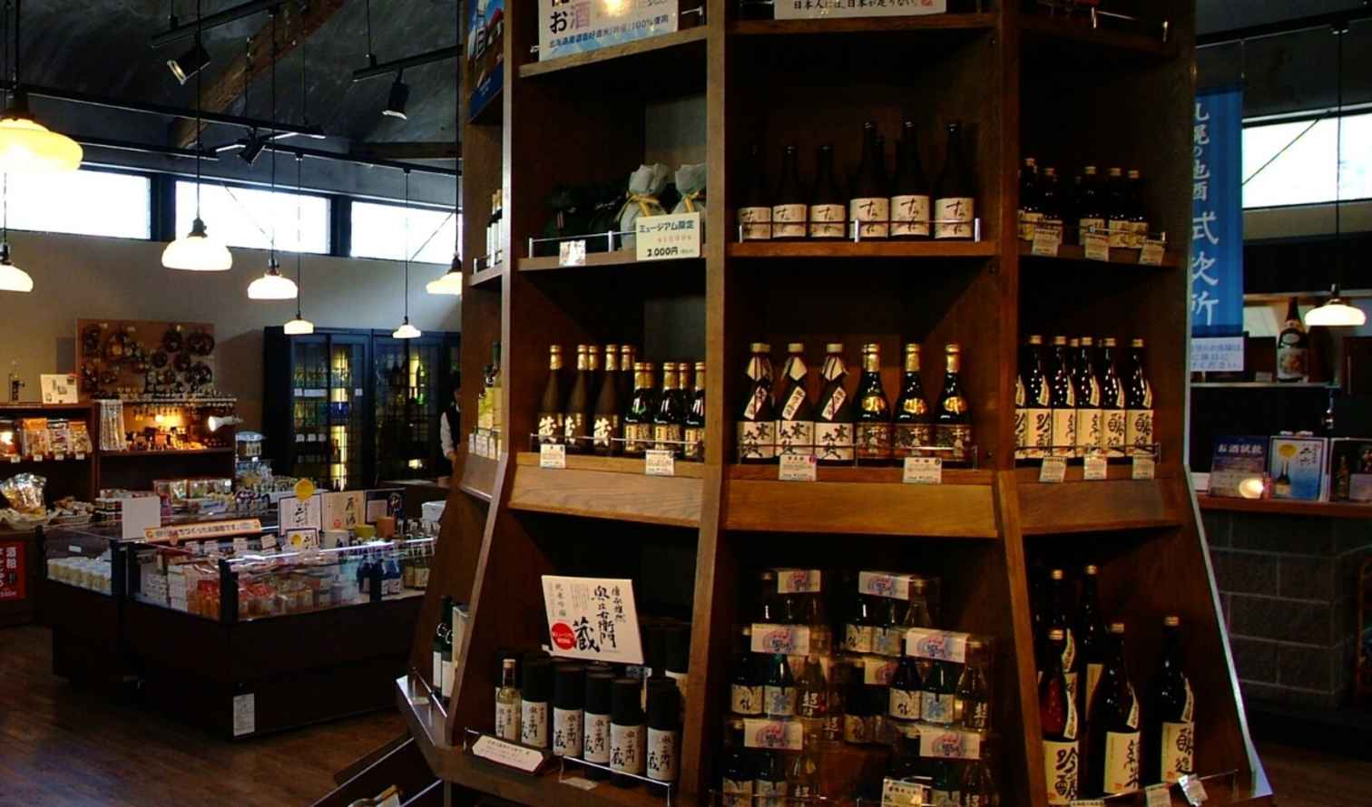 Shelves stocked with sake and Japanese goods in a retail environment in Sapporo