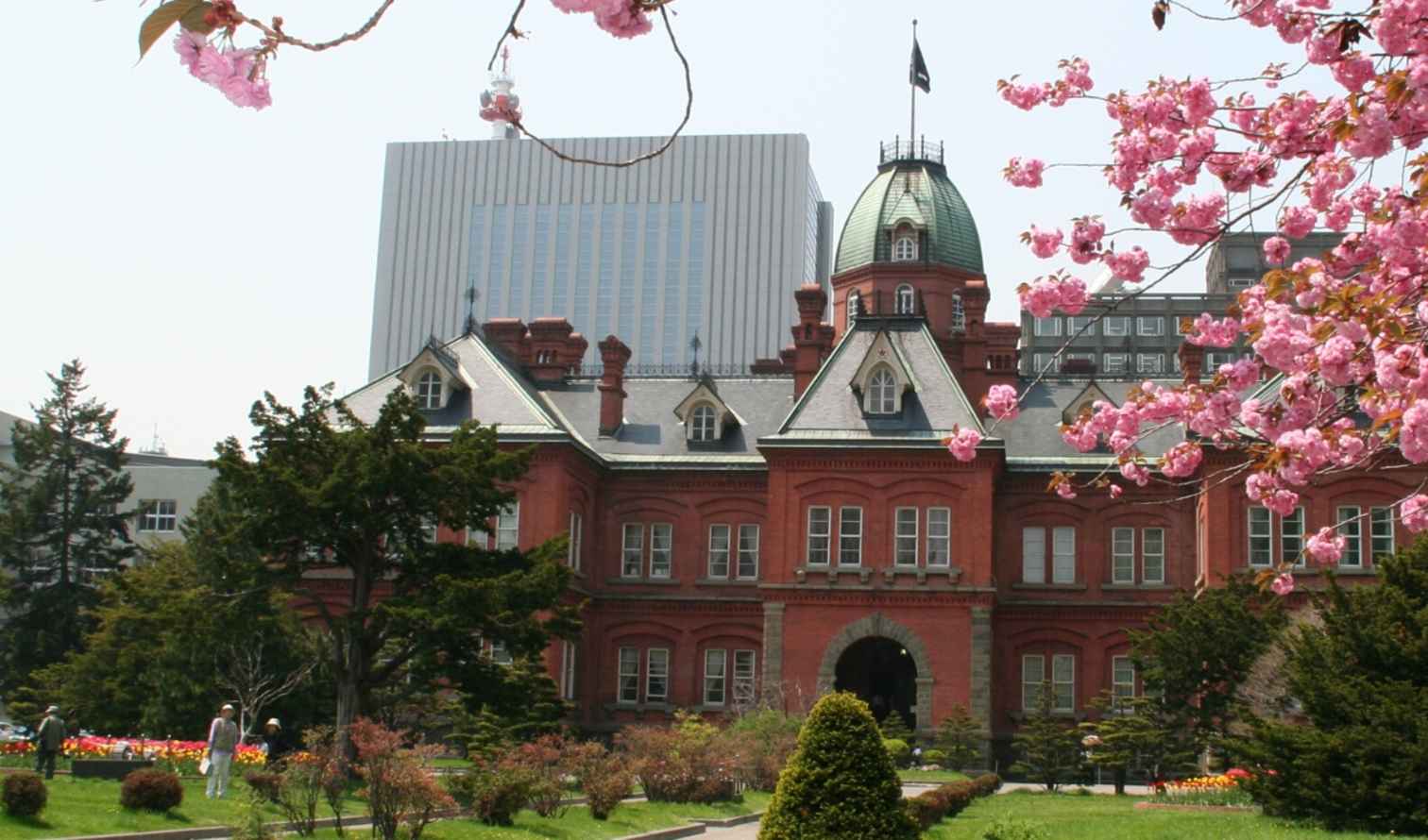 Former Hokkaido Government Office Building in Sapporo surrounded by cherry blossoms.