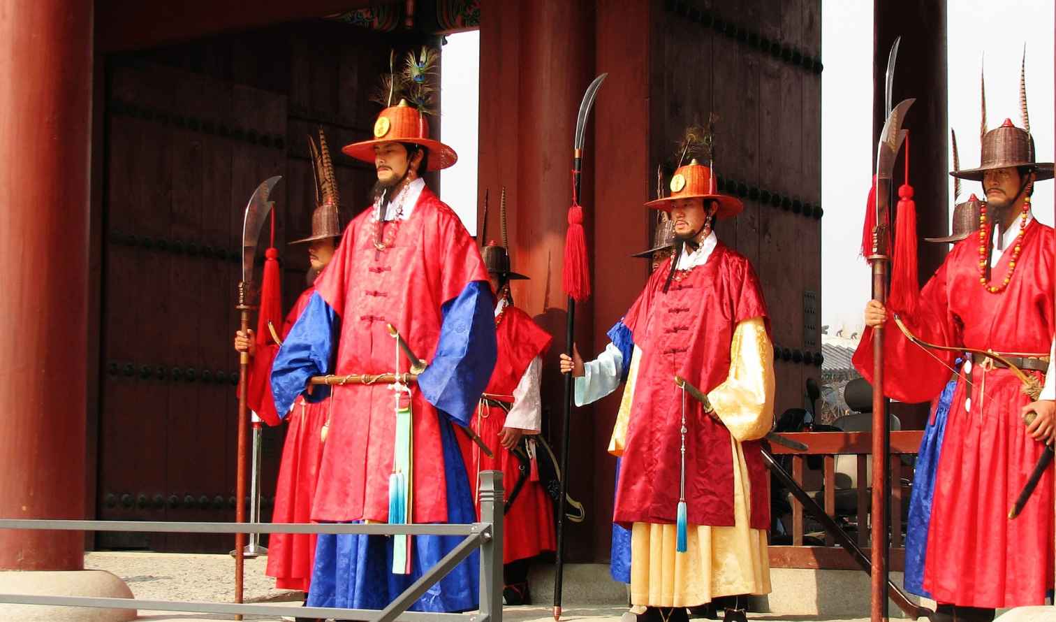 Traditional guards in colorful uniforms at Gyeongbokgung Palace, Seoul.
