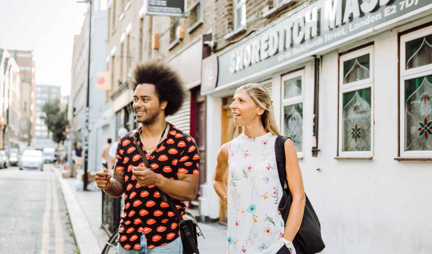 Two people walking on Redchurch Street, Shoreditch, London.