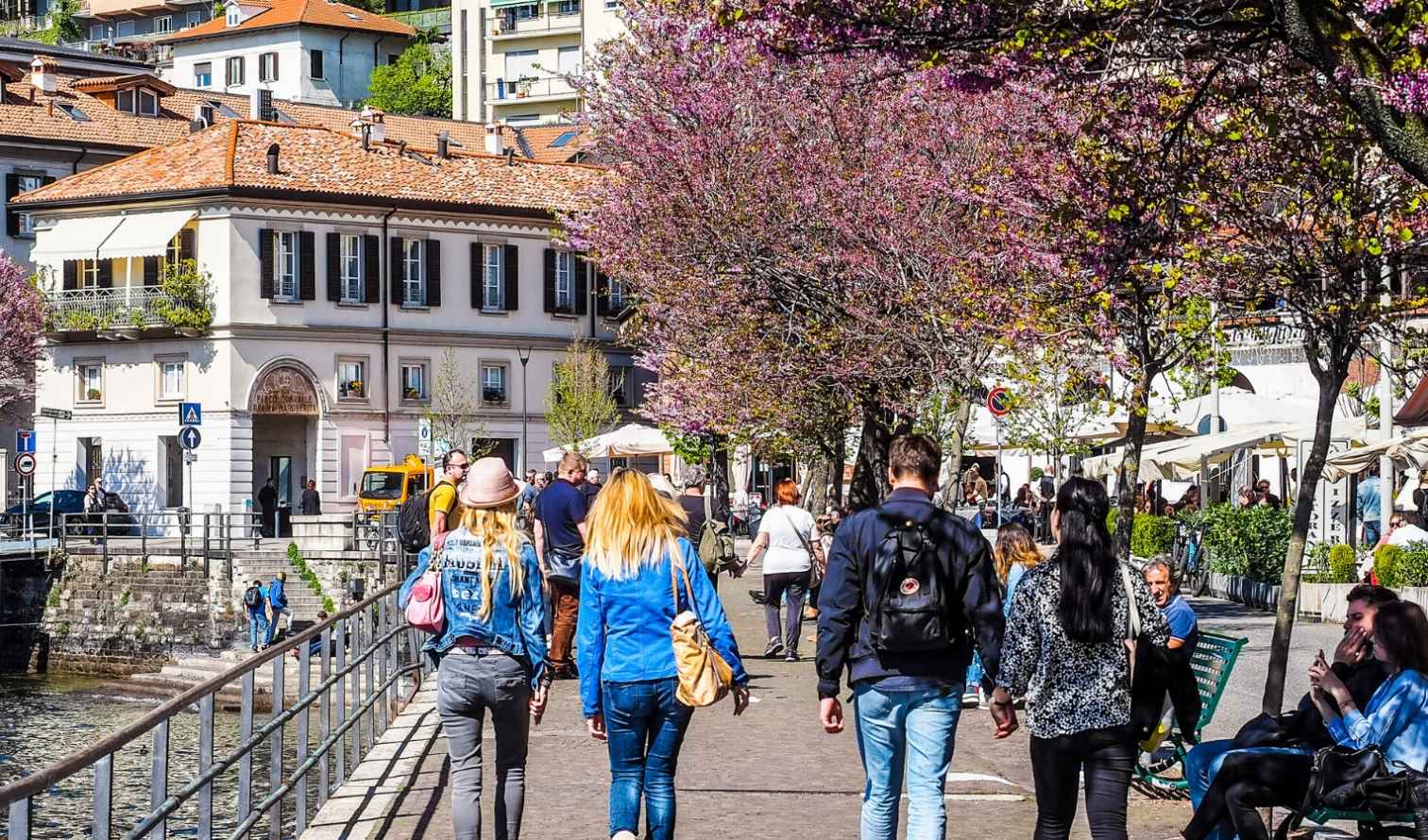 People walking along the waterfront in Como, Italy.