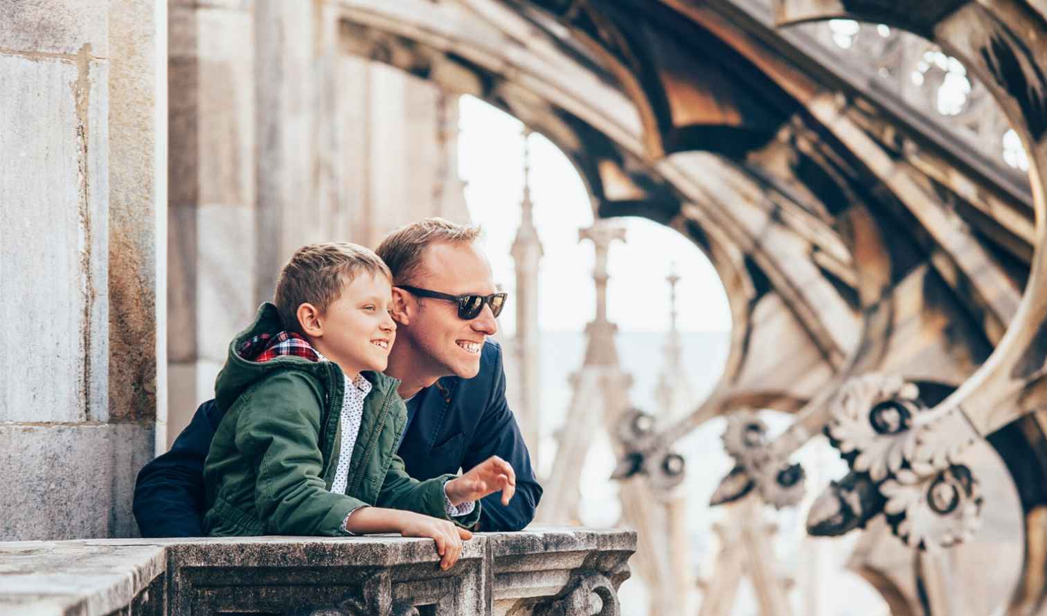 Two people looking out from the rooftop of Milan Cathedral.