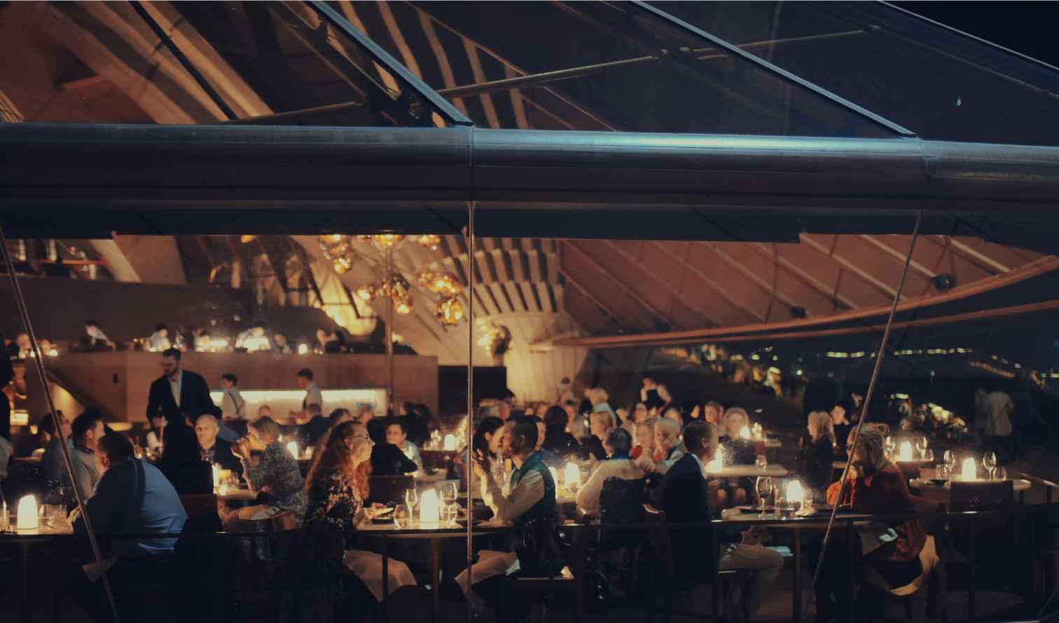 People dining inside a restaurant at the Sydney Opera House.