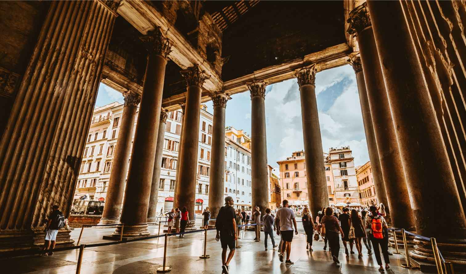 Crowd of people walking inside the Pantheon in Rome, Italy.