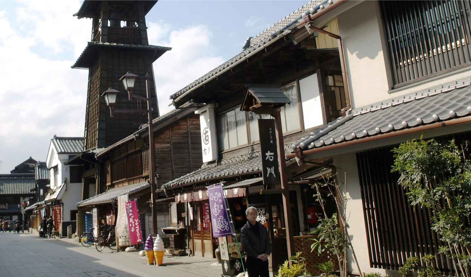 Traditional wooden buildings and Toki no Kane bell tower in Kawagoe, Japan.