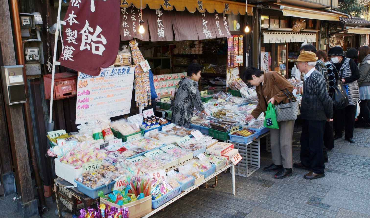 Outdoor market stall selling traditional sweets in Kawagoe