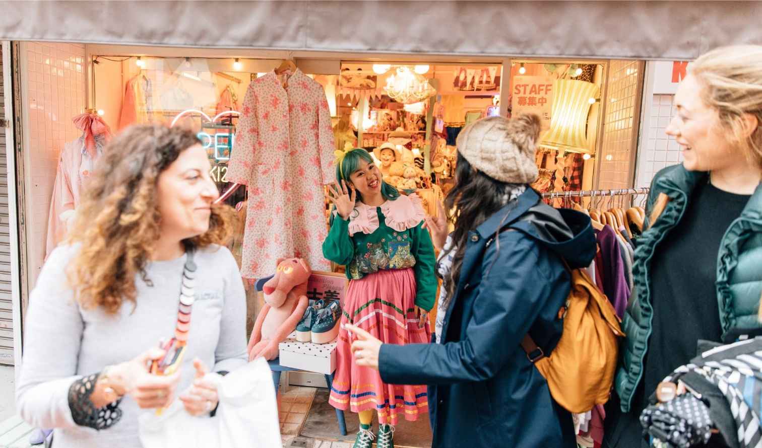 Group outside a colorful clothing store in Harajuku, Tokyo.