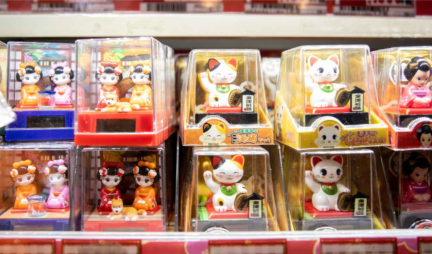 Store display featuring Maneki-neko and traditional Japanese figures in Tokyo