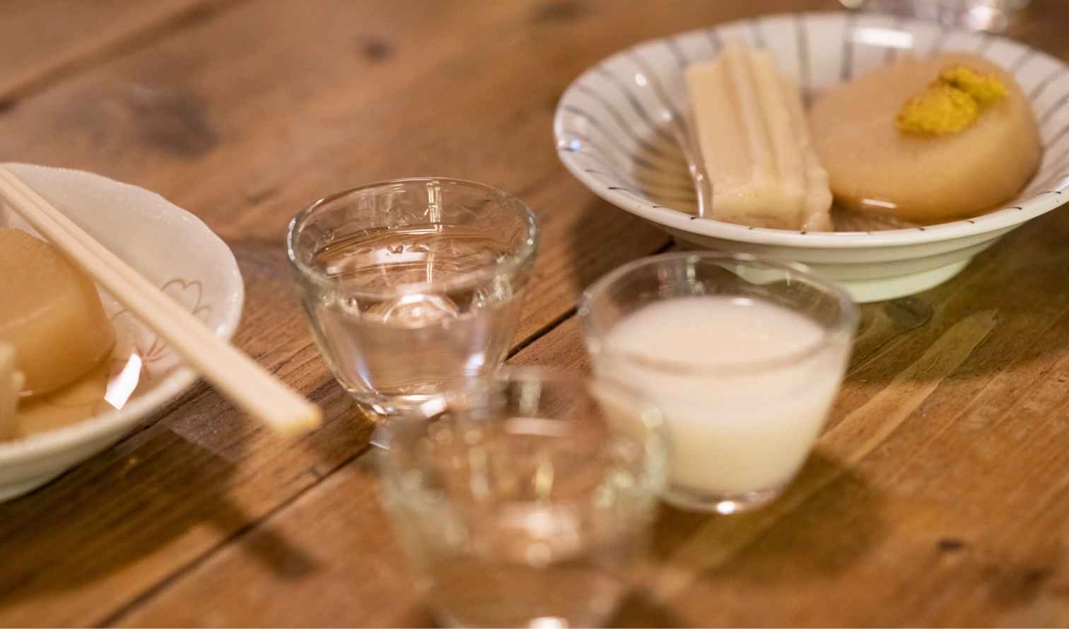 Plate with daikon and mustard next to two glasses  in Tokyo
