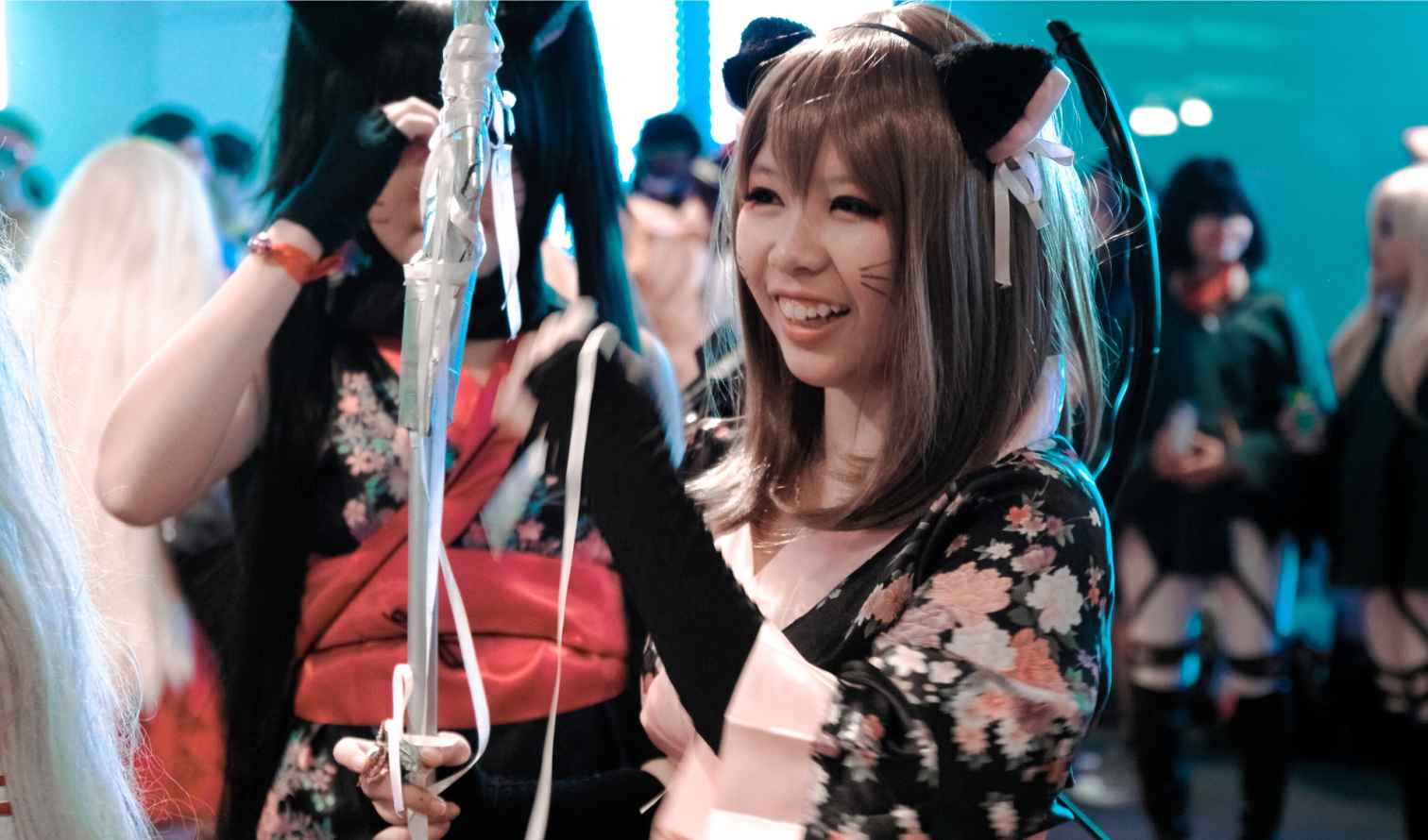 People dressed in cosplay outfits at a public event indoors in Tokyo