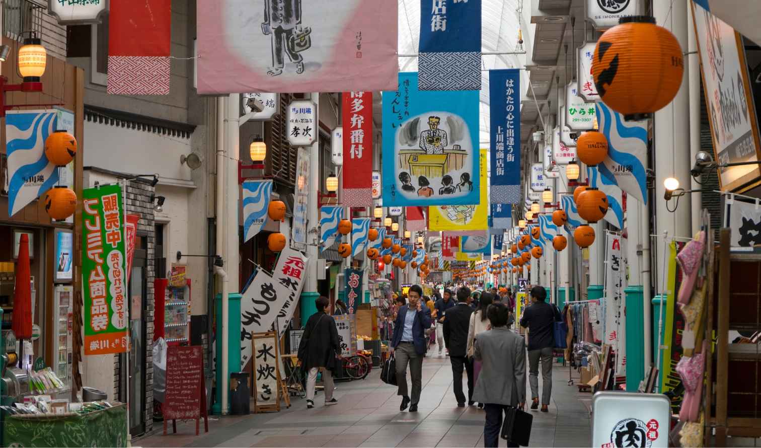 People walking through Kawabata Shopping Arcade in Fukuoka, Japan.