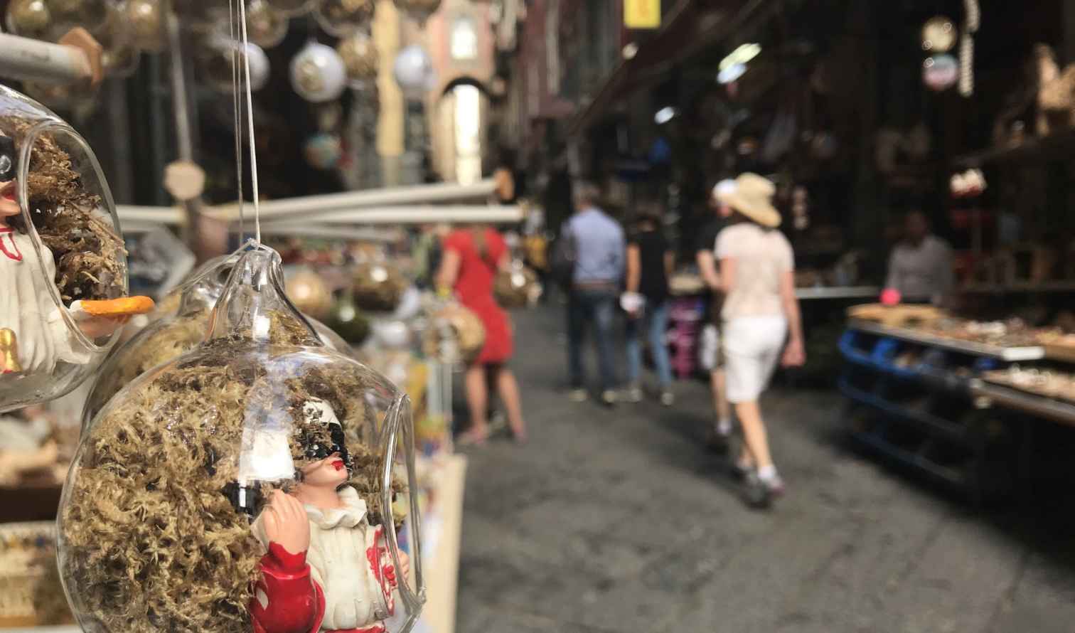 Street market with hanging glass ornaments in Naples, Italy.