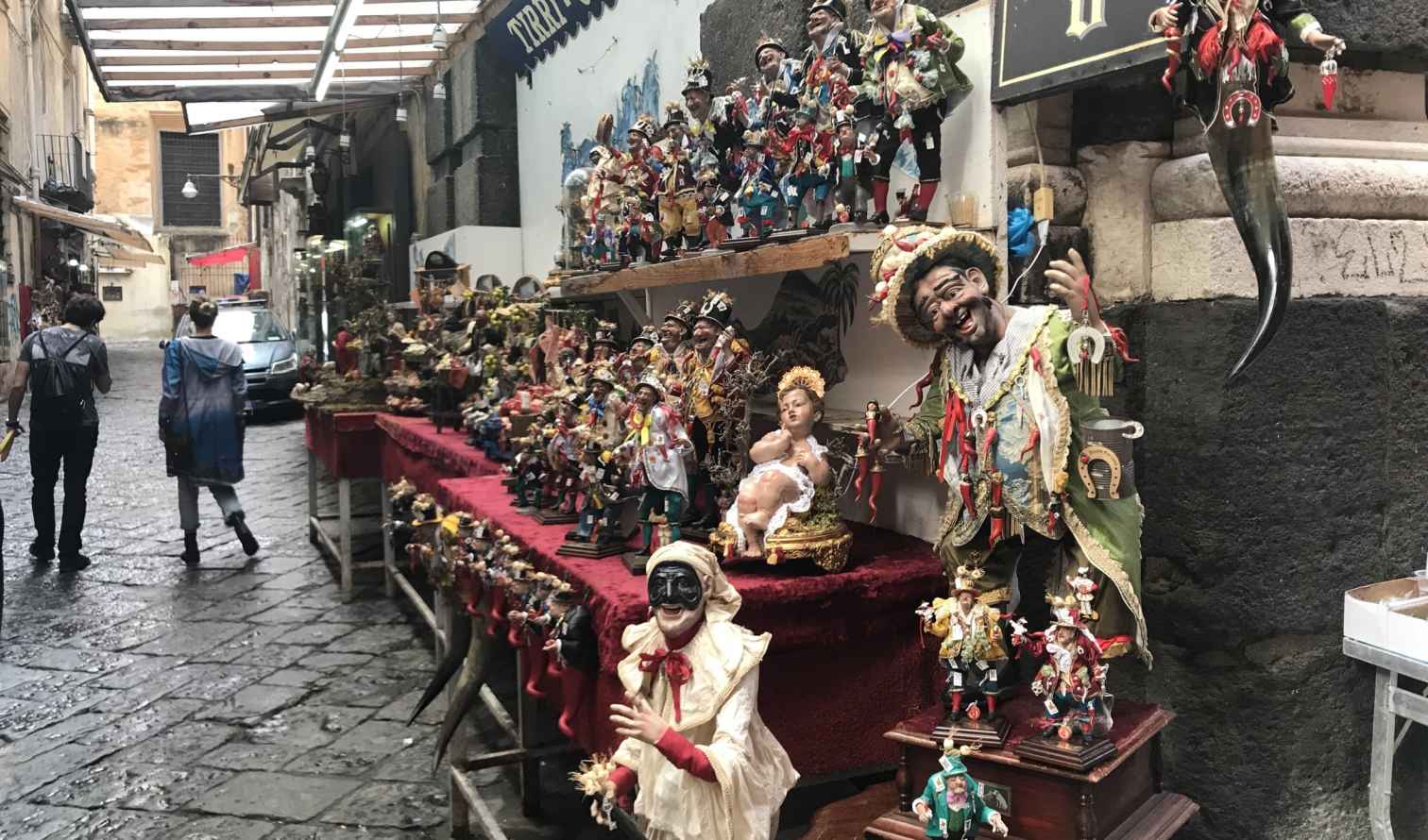 View of Via San Gregorio Armeno with figurines on display in Naples, Italy.