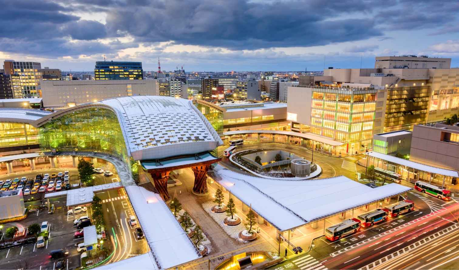 Kanazawa Station with its distinctive glass dome roof and Tsuzumi Gate.
