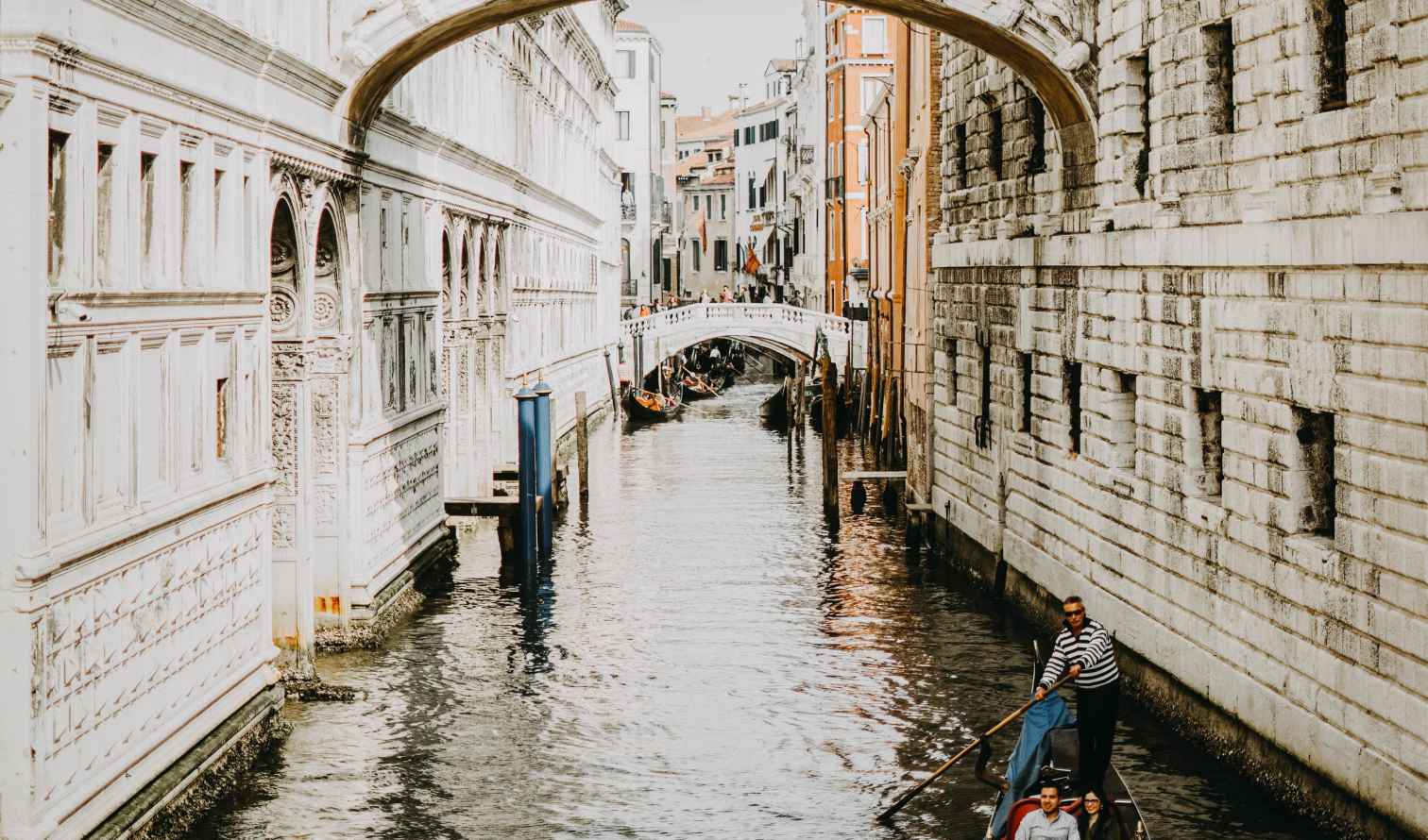 Gondola passing under the Bridge of Sighs in Venice, Italy.