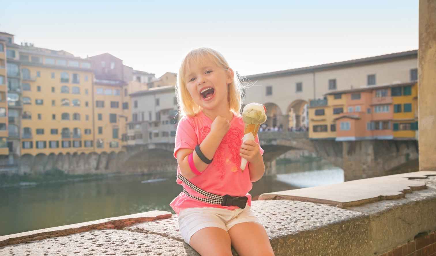 Child holding ice cream near Ponte Vecchio, Florence.