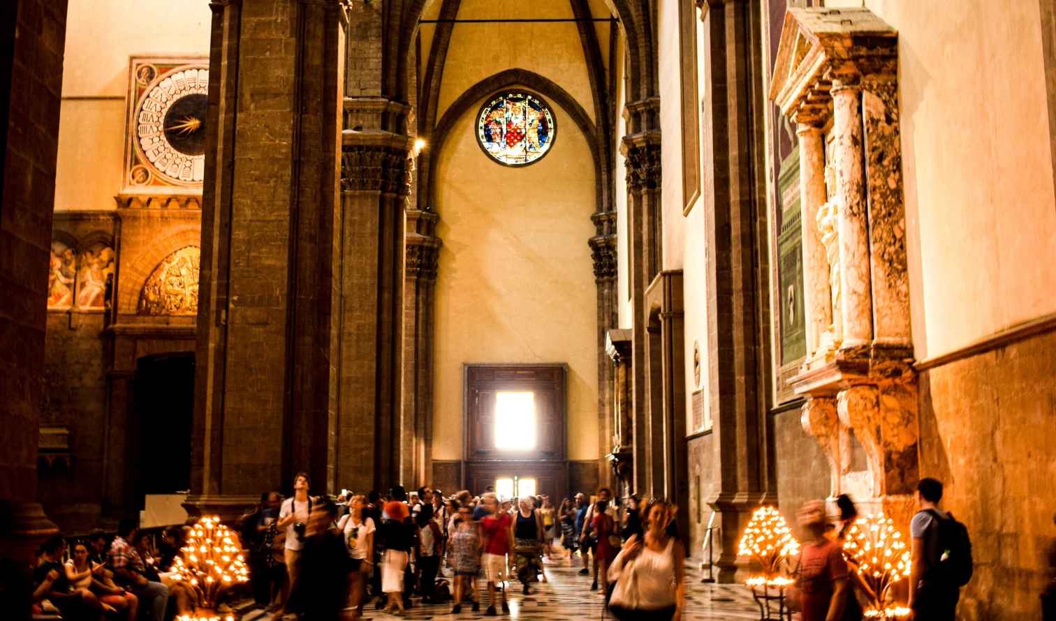Detail of the vaulted ceiling and stained glass in Santa Maria Novella, Florence.