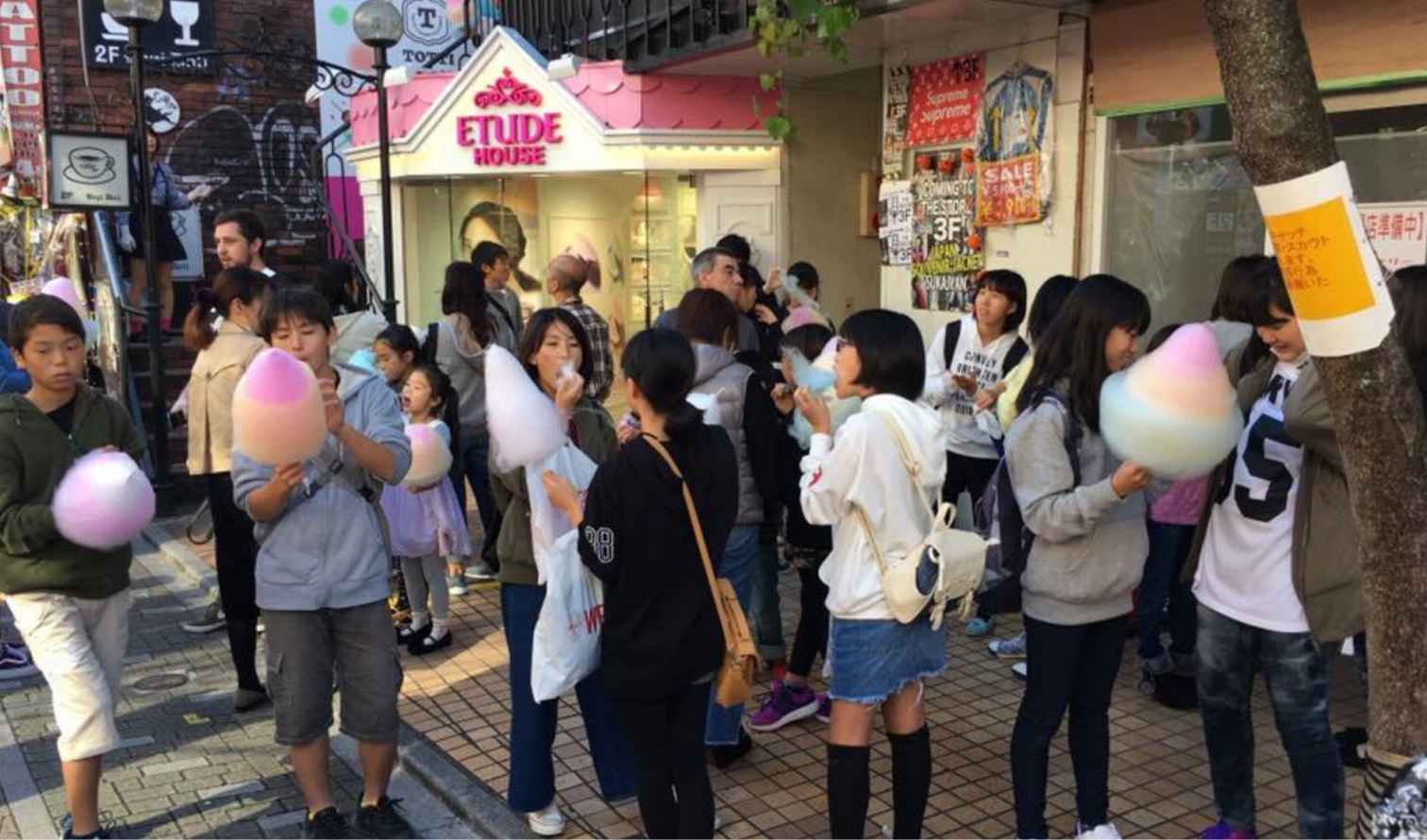 People holding cotton candy on Takeshita Street, Harajuku, in Osaka