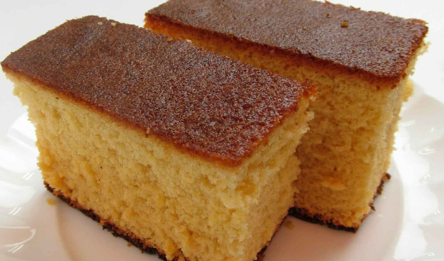 Two slices of sponge cake on a white plate in Nagasaki 