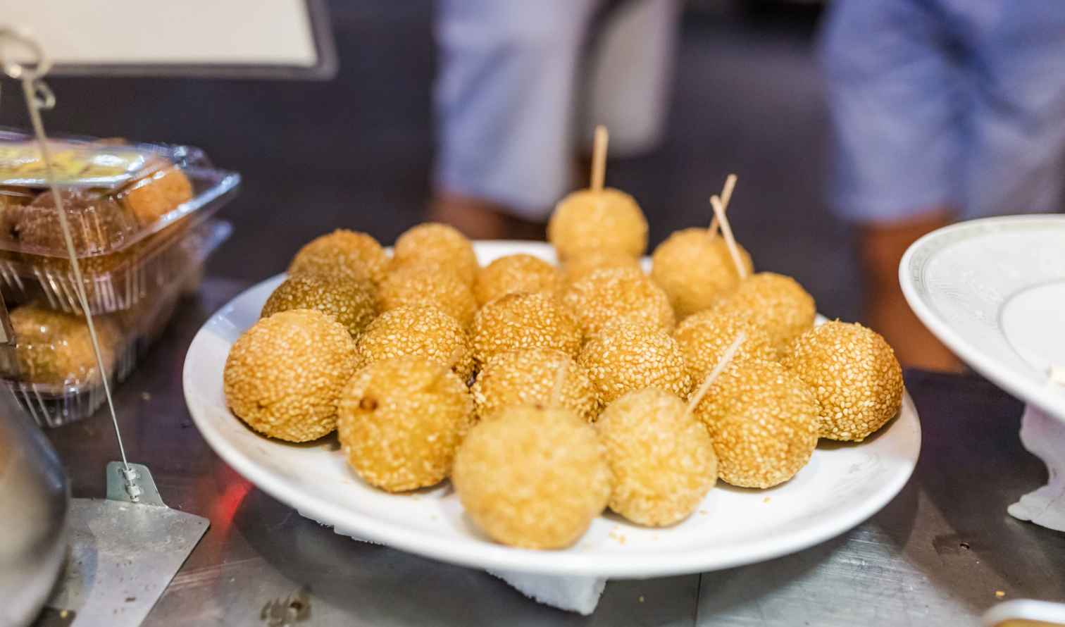 Plate of sesame balls on a street food vendor's table in Nagasaki 