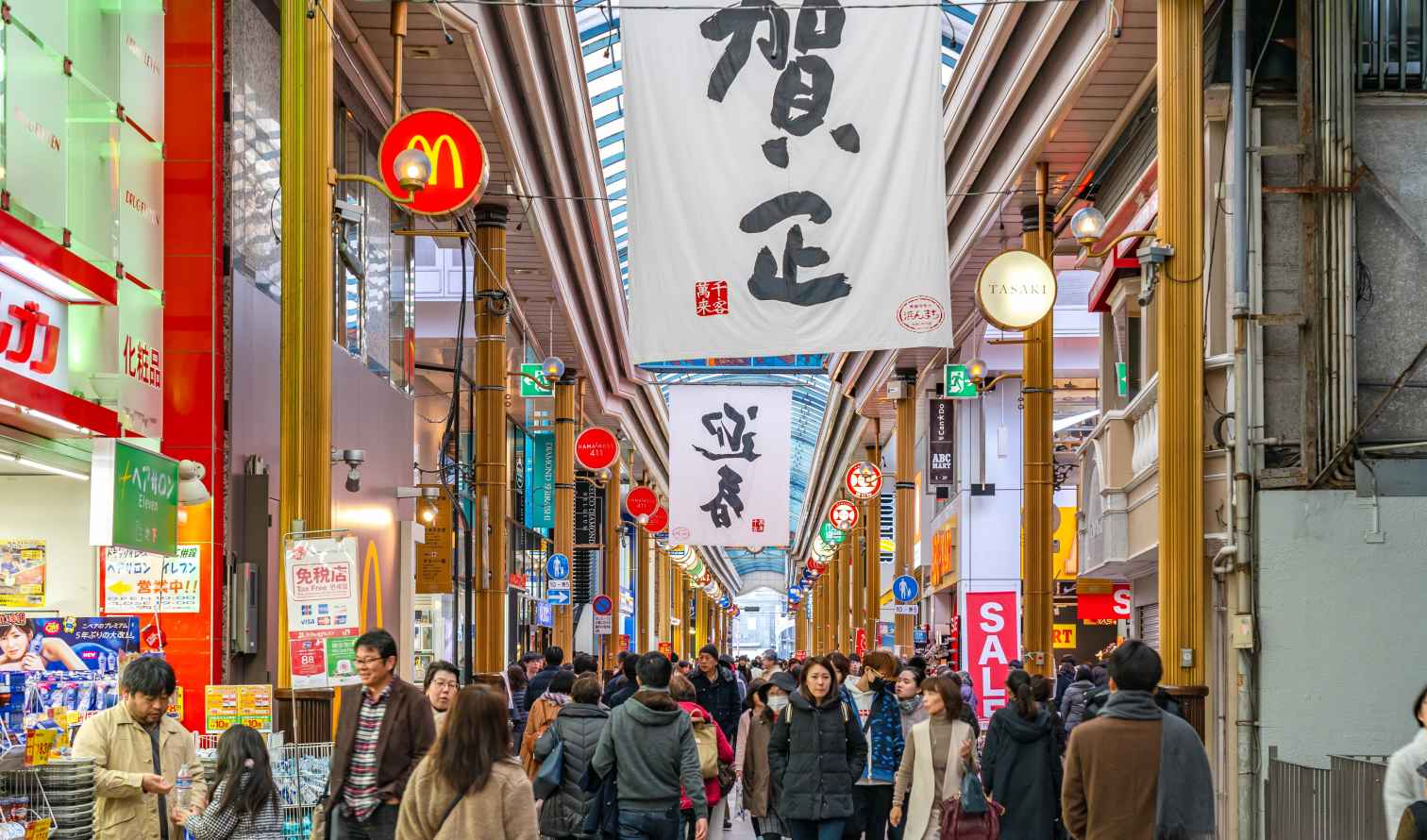 Shoppers walk through the Shinsaibashi shopping arcade in Nagasaki 
