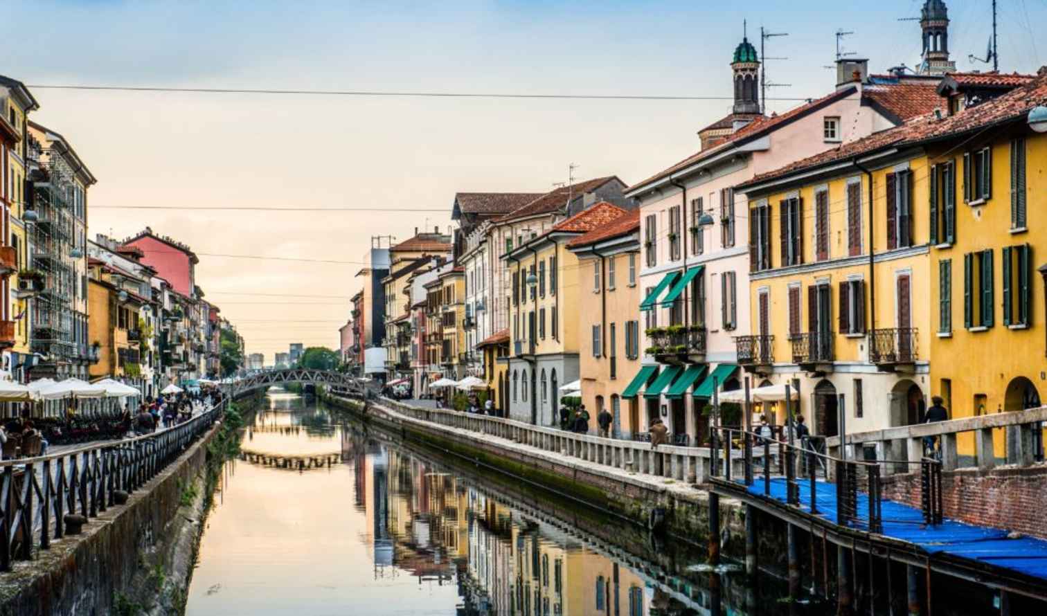 Naviglio Grande canal with colorful buildings in Milan, Italy.