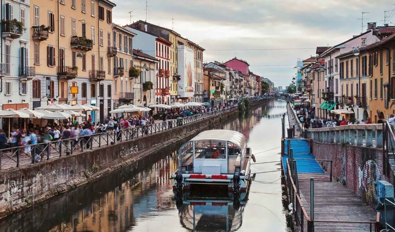 A boat is moored in the Navigli canal, Milan.