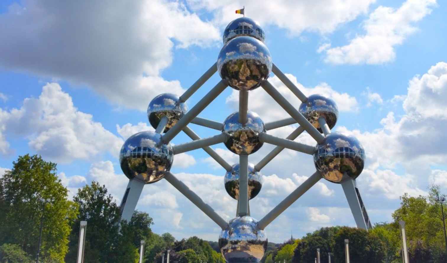 View of the Atomium structure in Brussels against a cloudy sky.