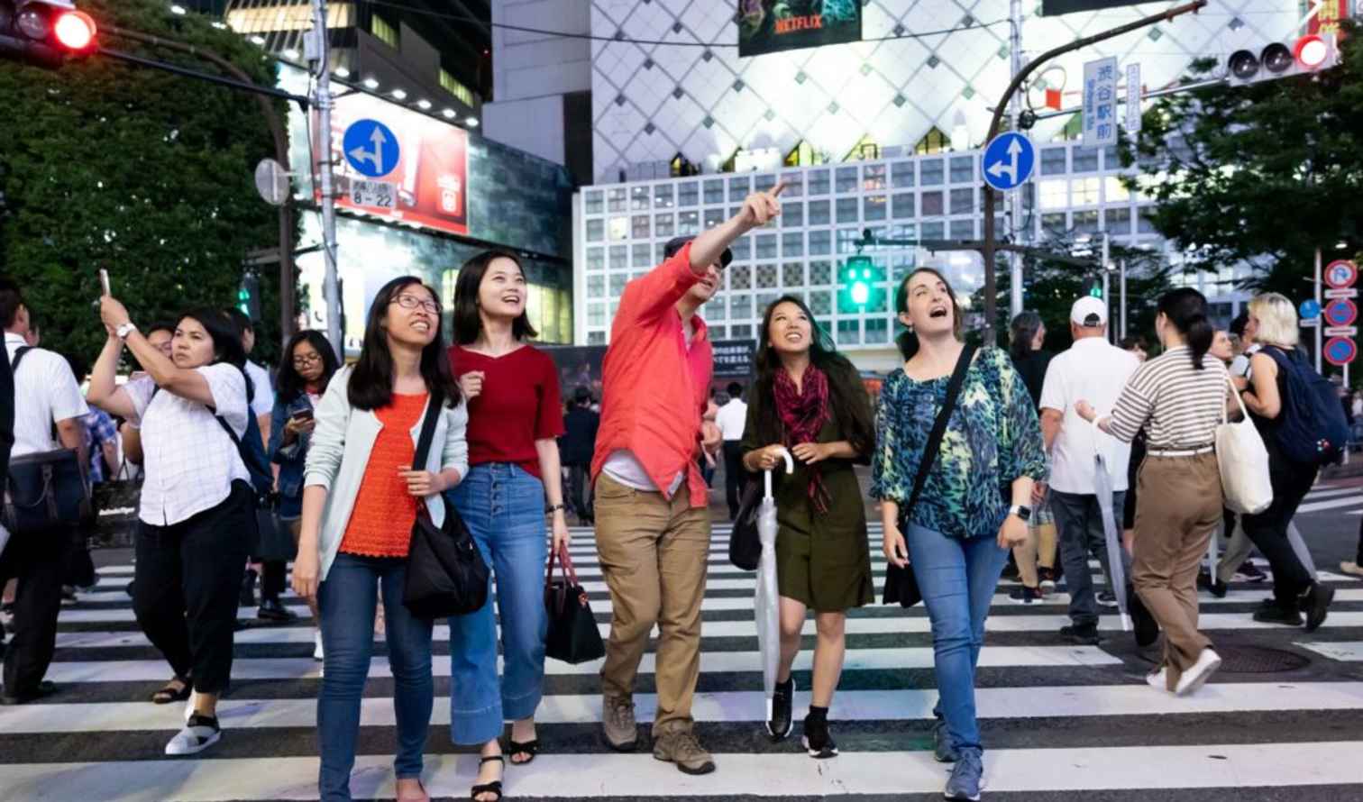 People crossing Shibuya Crossing in Tokyo, Japan.